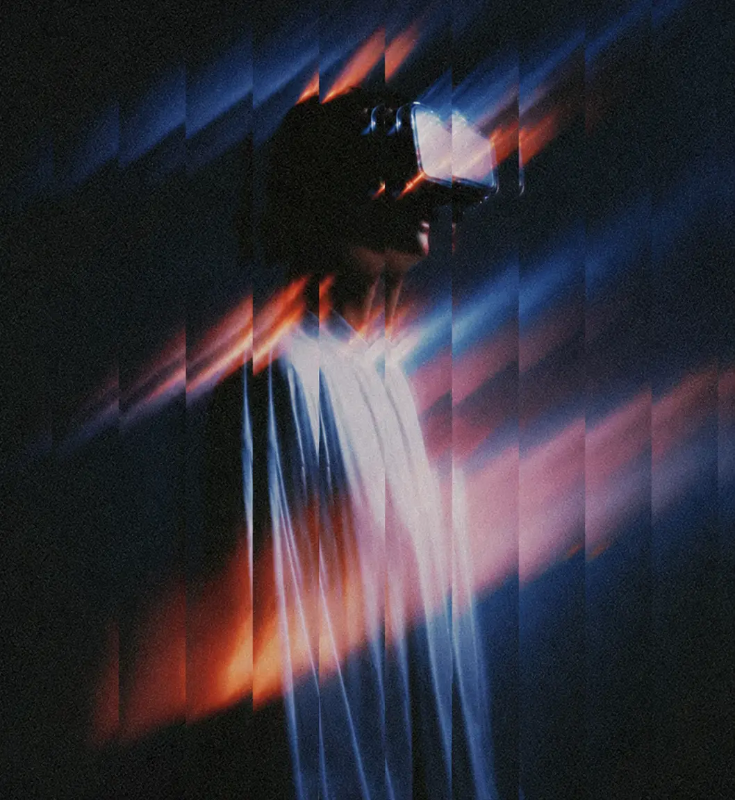 Figure wearing a VR headset dissolving into motion-blurred light